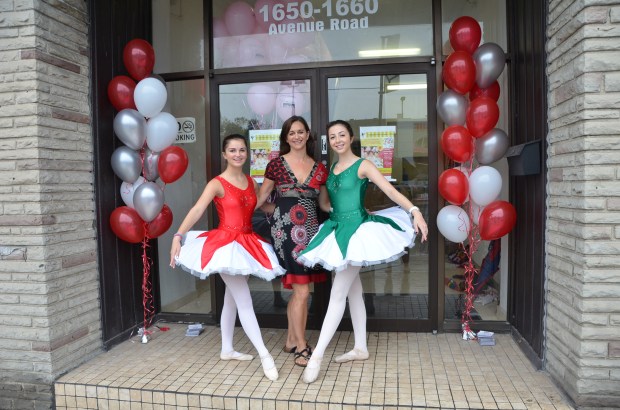 STRIKING POSES: Martha Hicks, namesake of the Martha Hicks School of Ballet, welcomed guests to her new location on Avenue Road with the help of ballerinas Danielle Filler,  left, and Nikki Richardson, right, during her grand opening party on Sept. 7.
